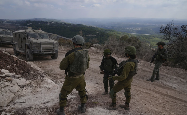 Israeli soldiers are seen during a ground operation in southern Lebanon, near the border with Israel, Sunday, Oct. 13, 2024. 


